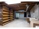 Unfinished basement featuring built-in wooden shelving, utility sink, and concrete foundation walls at 3856 Egypt Rd, Snellville, GA 30039