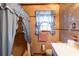 This bathroom features blue curtains and an older vanity at 3856 Egypt Rd, Snellville, GA 30039