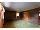 Bedroom with wood paneling and closet space; a window offers natural light at 3856 Egypt Rd, Snellville, GA 30039