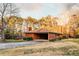 Exterior shot of a single story brick home with a covered carport and well-maintained landscaping at 3856 Egypt Rd, Snellville, GA 30039