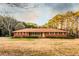 A charming single-story brick home with a well-manicured lawn and classic design at 3856 Egypt Rd, Snellville, GA 30039