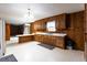 Functional kitchen with wood cabinets and ample counter space, perfect for culinary enthusiasts at 3856 Egypt Rd, Snellville, GA 30039