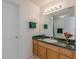 Bathroom features wood vanity, laminate countertops and neutral decor at 539 Creekview Overlook, Stockbridge, GA 30281