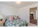 Charming bedroom with floral bedding and ample natural light at 539 Creekview Overlook, Stockbridge, GA 30281
