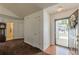 Welcoming foyer with hardwood and carpet, featuring fresh paint, and convenient closet space at 539 Creekview Overlook, Stockbridge, GA 30281