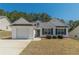 Charming single-Gathering home featuring a well-maintained lawn and an attached one car garage at 539 Creekview Overlook, Stockbridge, GA 30281