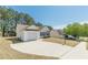 Delightful home with a one-car garage and a driveway on a sunny day in a quiet neighborhood at 539 Creekview Overlook, Stockbridge, GA 30281