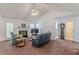 Bright living room featuring a cozy fireplace, high ceilings, and a neutral color palette at 539 Creekview Overlook, Stockbridge, GA 30281