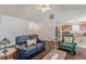 Inviting living room with vaulted ceilings that opens to the kitchen, perfect for entertaining guests at 539 Creekview Overlook, Stockbridge, GA 30281