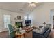 Comfortable living room showcasing a fireplace, natural light, and vaulted ceilings for a spacious feel at 539 Creekview Overlook, Stockbridge, GA 30281