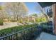 Balcony view of the complex featuring lush trees and parking at 2921 Lenox Ne Rd # 113, Atlanta, GA 30324