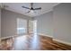 Bedroom featuring hardwood floors, a ceiling fan, and a large window at 2921 Lenox Ne Rd # 113, Atlanta, GA 30324