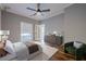 Stylish bedroom with a ceiling fan, hardwood floors, and an outside balcony at 2921 Lenox Ne Rd # 113, Atlanta, GA 30324