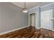 Bedroom with wood floors, closet and white entry door at 2921 Lenox Ne Rd # 113, Atlanta, GA 30324
