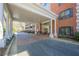 The entrance features a porte-cochere and leads to a brick facade with shuttered windows at 2921 Lenox Ne Rd # 113, Atlanta, GA 30324