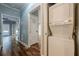 Hallway with wood-look flooring and a stacked washer and dryer unit at 2921 Lenox Ne Rd # 113, Atlanta, GA 30324