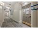 Well-lit hallway featuring elegant archways and neutral gray patterned carpeting at 2921 Lenox Ne Rd # 113, Atlanta, GA 30324