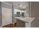 View of modern updated kitchen from entry with stainless appliances at 2921 Lenox Ne Rd # 113, Atlanta, GA 30324