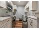 Modern condo kitchen with stainless steel appliances and subway tile backsplash at 2921 Lenox Ne Rd # 113, Atlanta, GA 30324