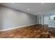 Open concept living room with hardwood floors and light blue walls at 2921 Lenox Ne Rd # 113, Atlanta, GA 30324