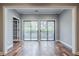 Living room featuring hardwood floors and sliding glass doors to a balcony at 2921 Lenox Ne Rd # 113, Atlanta, GA 30324