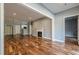 Spacious living room with hardwood floors and fireplace, leading to the kitchen at 2921 Lenox Ne Rd # 113, Atlanta, GA 30324