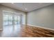 Spacious living room with hardwood floors and sliding doors to the outside at 2921 Lenox Ne Rd # 113, Atlanta, GA 30324