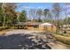 Brick house with attached carport and large front driveway at 6339 Cornelia Dr, Douglasville, GA 30134