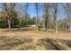 Brick home exterior in a wooded lot with lots of mature trees at 6339 Cornelia Dr, Douglasville, GA 30134