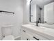 Modern bathroom with sleek black fixtures, vanity, and tiled shower at 1124 Country Ct, Lawrenceville, GA 30044