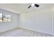Spacious bedroom with neutral carpet, ceiling fan, and natural light at 1124 Country Ct, Lawrenceville, GA 30044