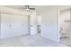 Bedroom with ensuite bathroom and ceiling fan at 1124 Country Ct, Lawrenceville, GA 30044