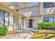 Charming townhouse with well-maintained landscaping and a covered entryway at 1124 Country Ct, Lawrenceville, GA 30044