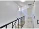 Upstairs hallway with gray carpet and black railing at 1124 Country Ct, Lawrenceville, GA 30044