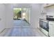 Kitchen with modern appliances and a sliding glass door to the outside at 1124 Country Ct, Lawrenceville, GA 30044