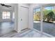 Bright living room featuring wood-look flooring, a ceiling fan, and sliding doors to the outside at 1124 Country Ct, Lawrenceville, GA 30044