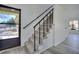 Carpeted staircase with black metal railing leading to the upper level of the home at 1124 Country Ct, Lawrenceville, GA 30044