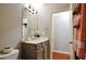 Neutral bathroom features a vanity with framed mirror, and a view of the doorway to the water closet at 2620 Sardis Chase Court, Buford, GA 30519