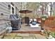 Spacious deck with outdoor seating and grill, ideal for entertaining or relaxing in a natural setting at 2620 Sardis Chase Court, Buford, GA 30519