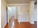 Hallway with hardwood floors and view into other rooms through open doorways at 2620 Sardis Chase Court, Buford, GA 30519