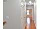 Hallway with hardwood floors and closet space, leading to other areas of the home at 2620 Sardis Chase Court, Buford, GA 30519