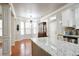 Kitchen and dining area with hardwood floors and modern lighting at 2620 Sardis Chase Court, Buford, GA 30519