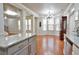 Open kitchen view with hardwood floors and expansive kitchen island at 2620 Sardis Chase Court, Buford, GA 30519