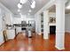Open concept kitchen with stainless steel appliances and living area at 2620 Sardis Chase Court, Buford, GA 30519