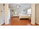 Spacious bedroom with wood floors, large windows, tray ceiling, and decorative columns at 2620 Sardis Chase Court, Buford, GA 30519