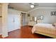 Main bedroom featuring hard wood floors, large closet with sliding barn door, and ensuite bathroom at 2620 Sardis Chase Court, Buford, GA 30519