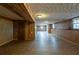 Spacious basement featuring wood paneled walls and wood flooring at 3637 Windmill Rd, Ellenwood, GA 30294