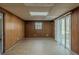 Large basement with wood paneled walls and wood flooring at 3637 Windmill Rd, Ellenwood, GA 30294