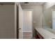 Bathroom featuring tile flooring, vanity with mirror, and a doorway to another room at 3637 Windmill Rd, Ellenwood, GA 30294
