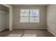 Sunlit bedroom with carpet, a large window, and light-colored walls at 3637 Windmill Rd, Ellenwood, GA 30294